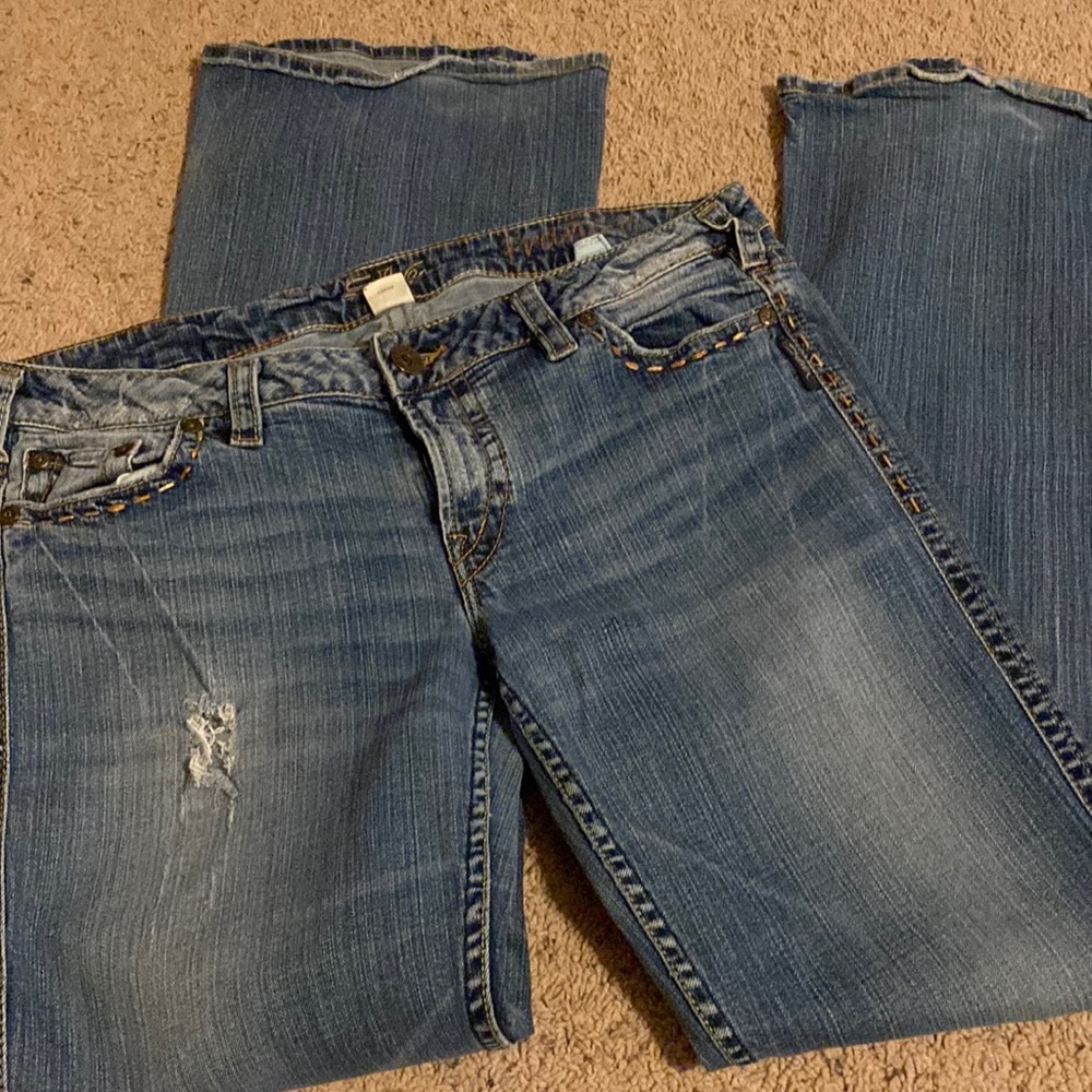 Silver jeans, worn but great condition.